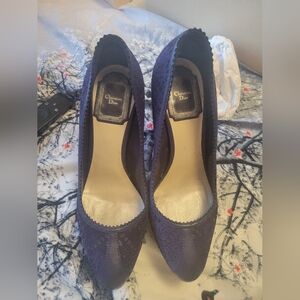 Blue Dior pumps.